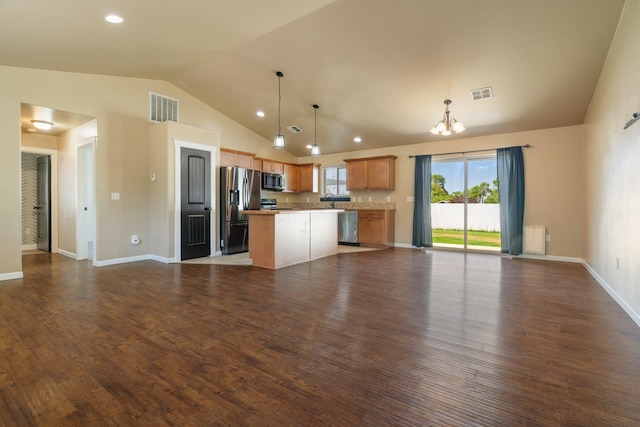 1819 N Center Ln, Spokane Valley, WA 99212 - kitchen with appliances with stainless steel finishes, open floor plan, a chandelier, a kitchen island, and lofted ceiling
