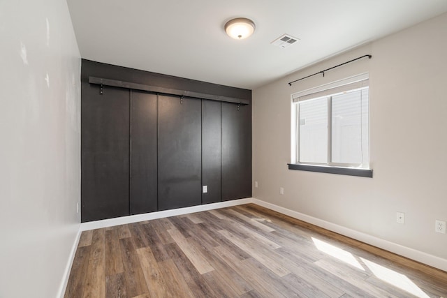 1819 N Center Ln, Spokane Valley, WA 99212 - unfurnished bedroom with wood finished floors and a closet