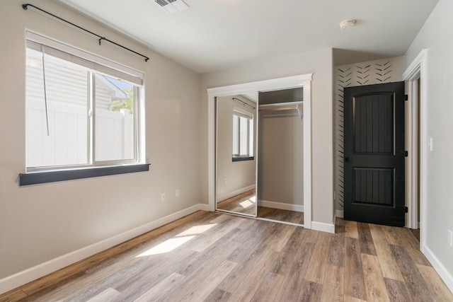 1819 N Center Ln, Spokane Valley, WA 99212 - unfurnished bedroom with light wood-style flooring and a closet