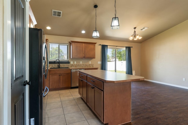 1819 N Center Ln, Spokane Valley, WA 99212 - kitchen with freestanding refrigerator, stainless steel dishwasher, plenty of natural light, a kitchen island, and recessed lighting