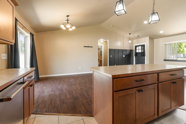 1819 N Center Ln, Spokane Valley, WA 99212 - kitchen with stainless steel dishwasher, lofted ceiling, hanging light fixtures, a center island, and light countertops