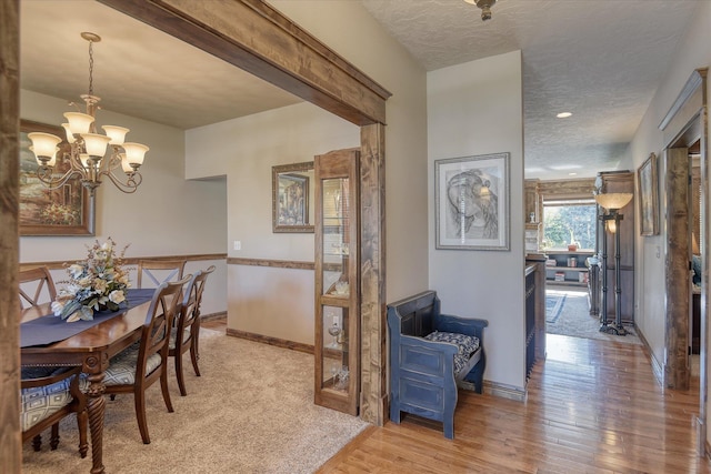 5908 N Bridget Rd, Spokane, WA 99208 - dining space featuring a chandelier, light wood-style flooring, a textured ceiling, and recessed lighting