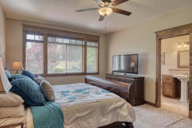 5908 N Bridget Rd, Spokane, WA 99208 - bedroom featuring light carpet, a ceiling fan, ensuite bathroom, and a textured ceiling