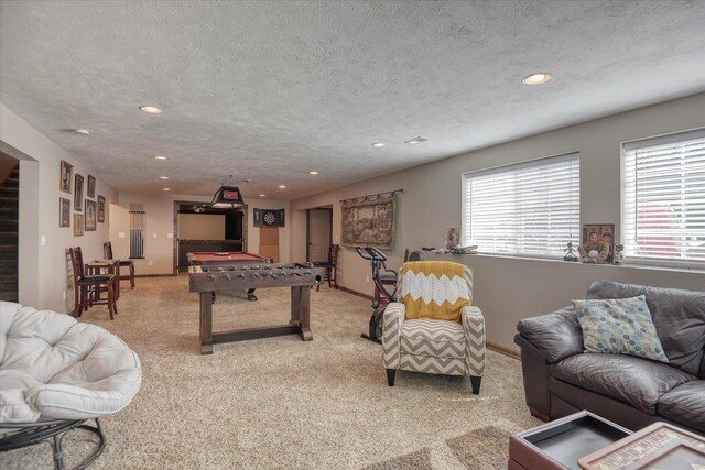 5908 N Bridget Rd, Spokane, WA 99208 - carpeted living area featuring a textured ceiling, healthy amount of natural light, recessed lighting, and a desk
