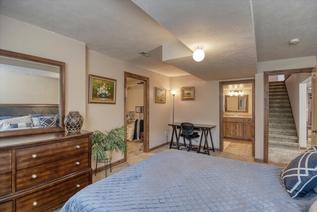 5908 N Bridget Rd, Spokane, WA 99208 - bedroom featuring light colored carpet and a textured ceiling