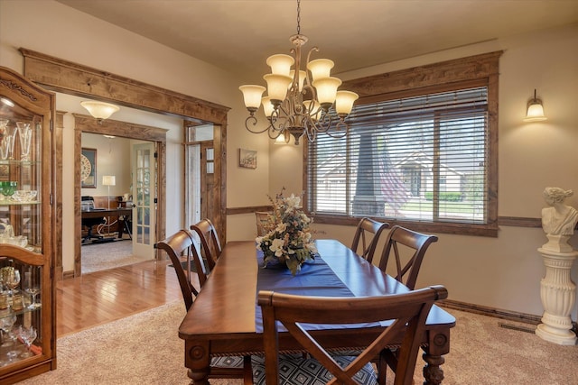 5908 N Bridget Rd, Spokane, WA 99208 - dining room with carpet and a chandelier