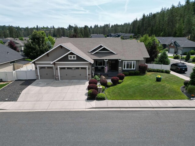 5908 N Bridget Rd, Spokane, WA 99208 - living area featuring a chandelier, a textured ceiling, a fireplace, light colored carpet, and recessed lighting