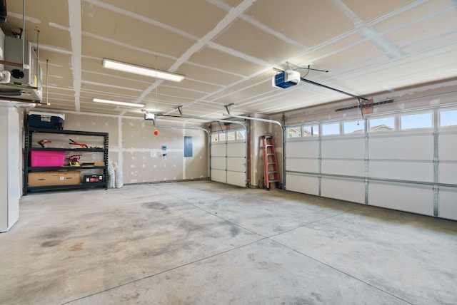 818 S Apple Pl, Spokane, WA 99224 - garage featuring a garage door opener and electric panel