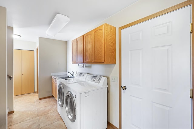 19915 S Ritchey Rd, Cheney, WA 99004 - laundry room with cabinet space, washing machine and dryer, and light tile patterned floors