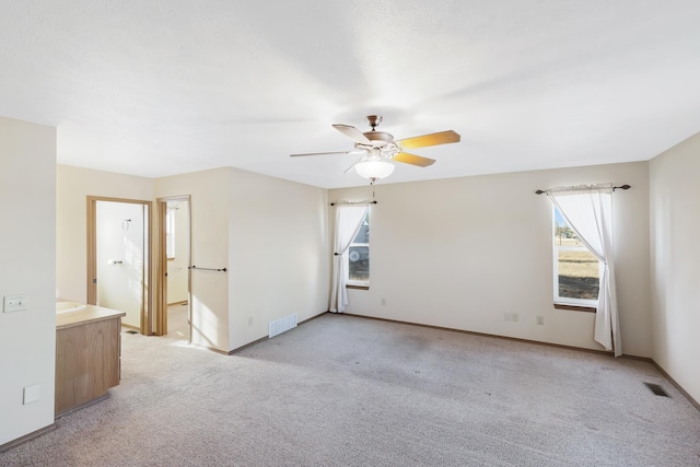 19915 S Ritchey Rd, Cheney, WA 99004 - empty room with light colored carpet, healthy amount of natural light, and a ceiling fan