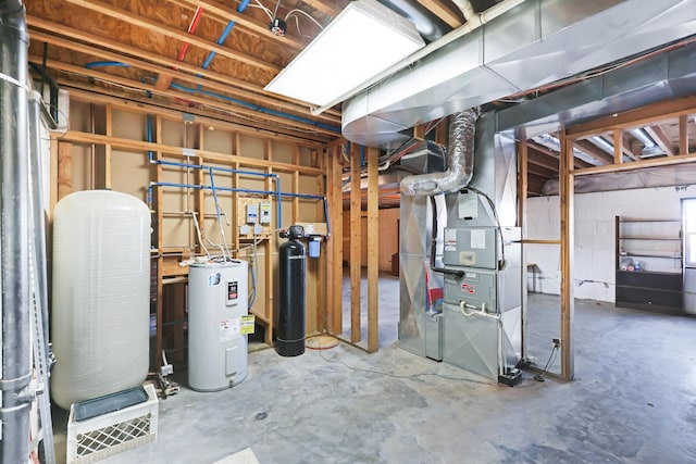 19915 S Ritchey Rd, Cheney, WA 99004 - unfinished below grade area featuring a water pressure tank, water heater, heating unit, and a water softener system