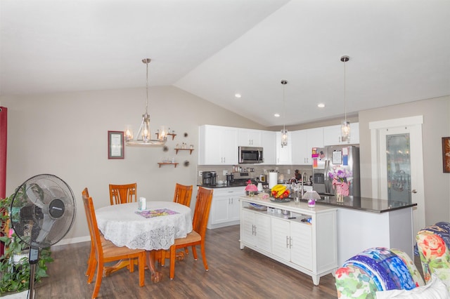 4017 E Hartson Ave, Spokane, WA 99202 - dining room featuring dark wood-style flooring, lofted ceiling, a chandelier, and recessed lighting