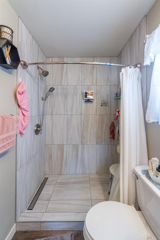 4017 E Hartson Ave, Spokane, WA 99202 - bathroom featuring toilet and a tile shower