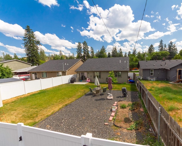4017 E Hartson Ave, Spokane, WA 99202 - back of property with a patio and a fenced backyard