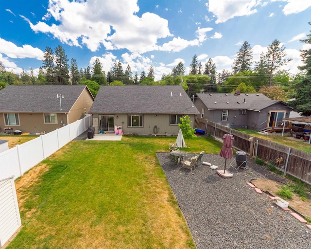 4017 E Hartson Ave, Spokane, WA 99202 - back of property with a patio area and a fenced backyard
