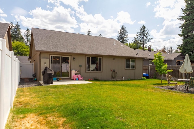 4017 E Hartson Ave, Spokane, WA 99202 - rear view of house with a patio area, a fenced backyard, and a shingled roof