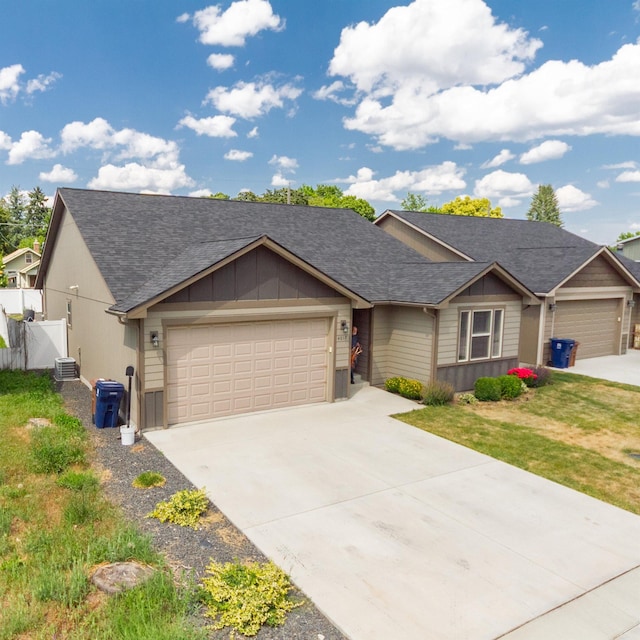 4017 E Hartson Ave, Spokane, WA 99202 - single story home featuring a garage, concrete driveway, and roof with shingles