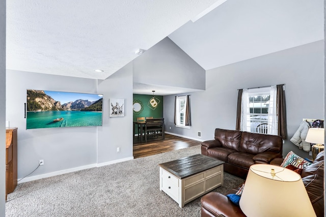 2202 E 50th Ave, Spokane, WA 99223 - carpeted living room featuring high vaulted ceiling and a textured ceiling