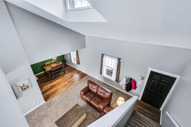 2202 E 50th Ave, Spokane, WA 99223 - living area featuring high vaulted ceiling, carpet, and wood finished floors