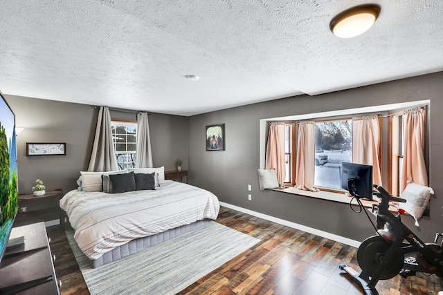 2202 E 50th Ave, Spokane, WA 99223 - bedroom featuring a textured ceiling and dark wood-style flooring