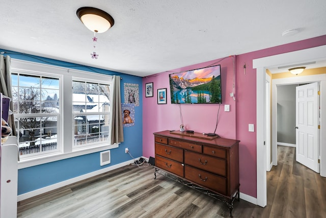 2202 E 50th Ave, Spokane, WA 99223 - bedroom with wood finished floors and a textured ceiling