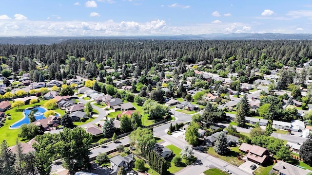 2202 E 50th Ave, Spokane, WA 99223 - aerial view of residential area featuring a heavily wooded area and a nearby body of water