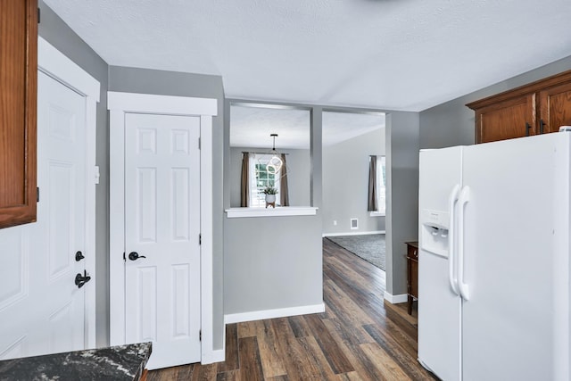 2202 E 50th Ave, Spokane, WA 99223 - kitchen featuring white fridge with ice dispenser and dark wood-style floors