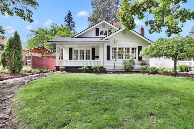1111 W 23rd Ave, Spokane, WA 99203 - view of front of property featuring a front yard, a chimney, and covered porch