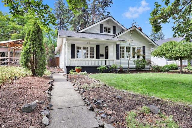 1111 W 23rd Ave, Spokane, WA 99203 - view of front of house with covered porch, a front lawn, and roof with shingles