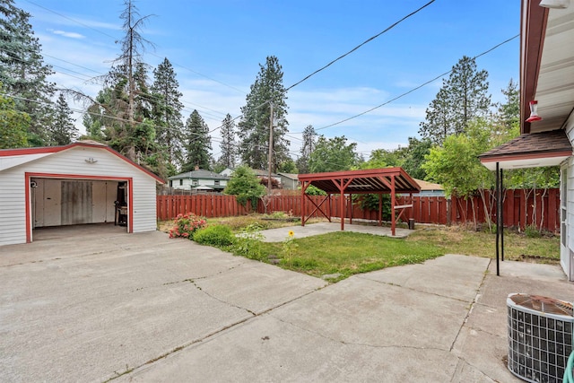 3918 E 8th Ave, Spokane, WA 99202 - fenced backyard featuring a detached garage and an outbuilding
