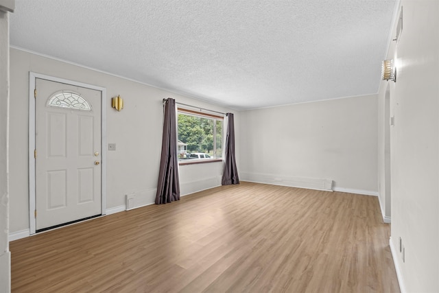 3918 E 8th Ave, Spokane, WA 99202 - foyer featuring a textured ceiling and light wood finished floors