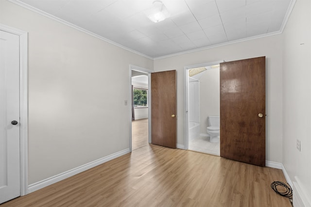 3918 E 8th Ave, Spokane, WA 99202 - unfurnished bedroom with light wood-style flooring, ornamental molding, and ensuite bath