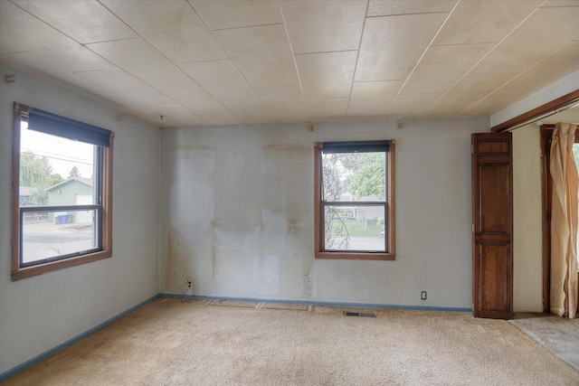 6423 N Washington St, Spokane, WA 99208 - empty room with healthy amount of natural light and carpet