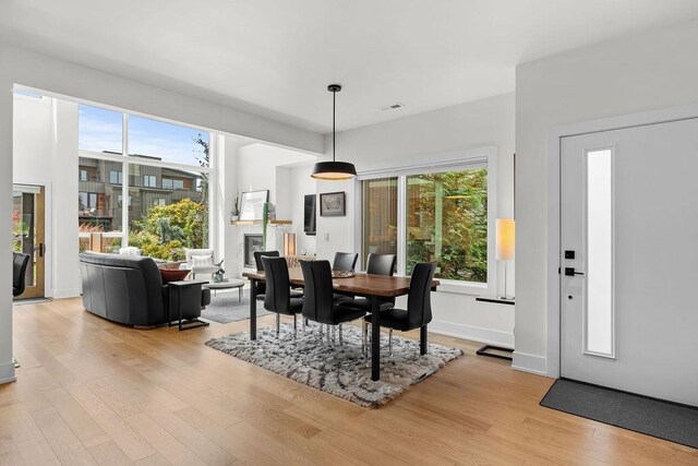 4408 E 23rd Ln, Spokane, WA 99223 - dining area featuring light wood finished floors and a glass covered fireplace