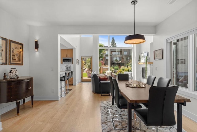 4408 E 23rd Ln, Spokane, WA 99223 - dining space featuring light wood-style flooring and baseboards