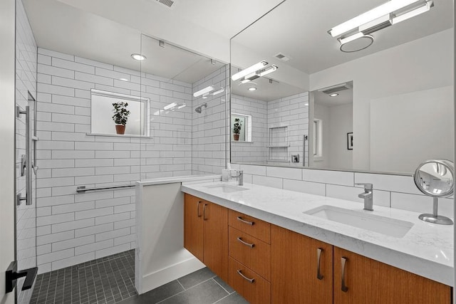 4408 E 23rd Ln, Spokane, WA 99223 - full bath with tile patterned floors, double vanity, a tile shower, and tile walls