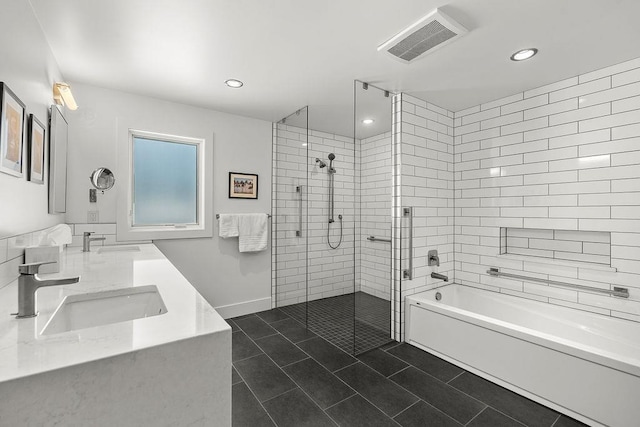 4408 E 23rd Ln, Spokane, WA 99223 - bathroom with tiled shower, tile patterned floors, double vanity, a bathtub, and recessed lighting