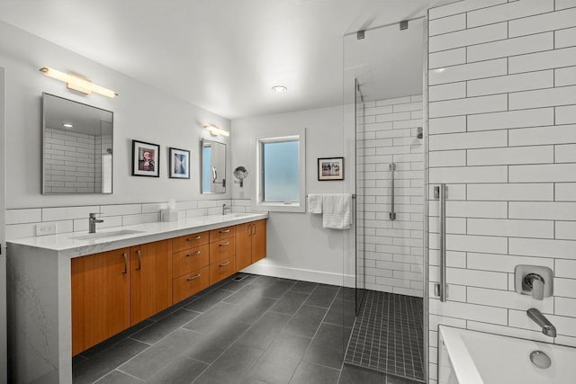 4408 E 23rd Ln, Spokane, WA 99223 - bathroom featuring a stall shower, a bath, double vanity, and tile patterned flooring