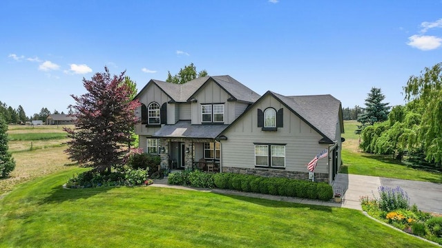 1615 W Country Hunt Ln, Spokane, WA 99224 - craftsman inspired home with stone siding, board and batten siding, a front yard, and a porch