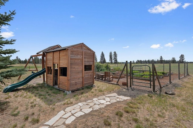 1615 W Country Hunt Ln, Spokane, WA 99224 - view of outdoor structure featuring a playground and a rural view