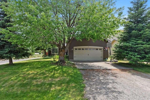 3224 E 42nd Ave, Spokane, WA 99223 - obstructed view of property with driveway, a front yard, and a garage