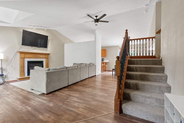 3224 E 42nd Ave, Spokane, WA 99223 - living area featuring wood finished floors, stairway, a fireplace, lofted ceiling, and ceiling fan