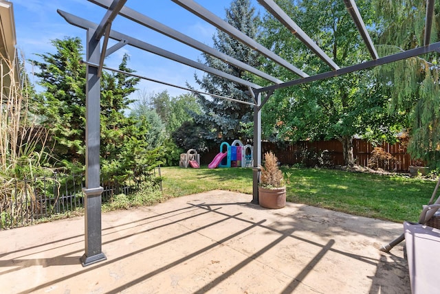 3224 E 42nd Ave, Spokane, WA 99223 - fenced backyard featuring a playground, a patio, and a pergola