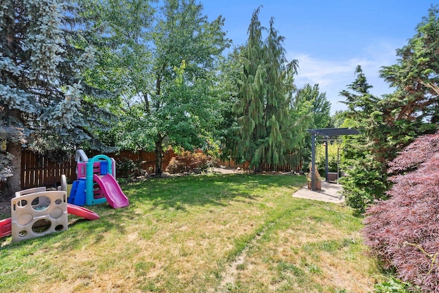 3224 E 42nd Ave, Spokane, WA 99223 - fenced backyard featuring a playground