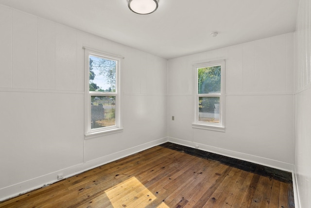 8007 E Euclid Ave, Spokane, WA 99212 - unfurnished room featuring dark wood-style flooring and healthy amount of natural light