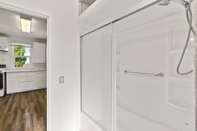 8007 E Euclid Ave, Spokane, WA 99212 - bathroom featuring a shower with door and wood finished floors