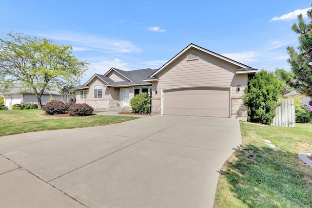 2019 S Saint Charles Rd, Veradale, WA 99037 - ranch-style home with driveway, an attached garage, and a front lawn