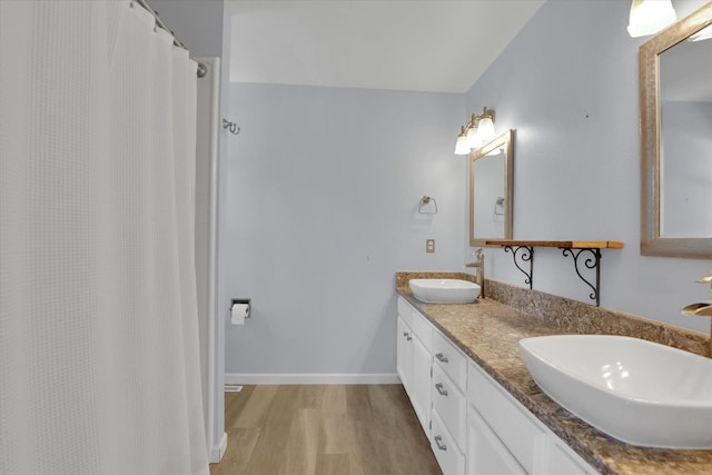 2019 S Saint Charles Rd, Veradale, WA 99037 - full bathroom with wood finished floors, double vanity, and a shower with curtain