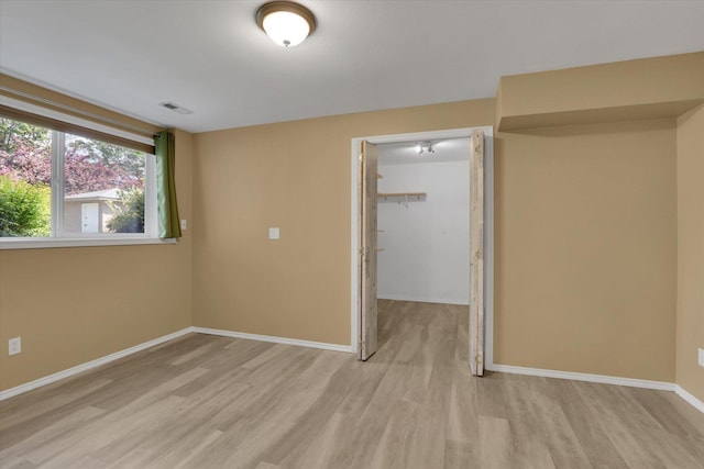 2019 S Saint Charles Rd, Veradale, WA 99037 - unfurnished bedroom with light wood-type flooring, a spacious closet, and a closet