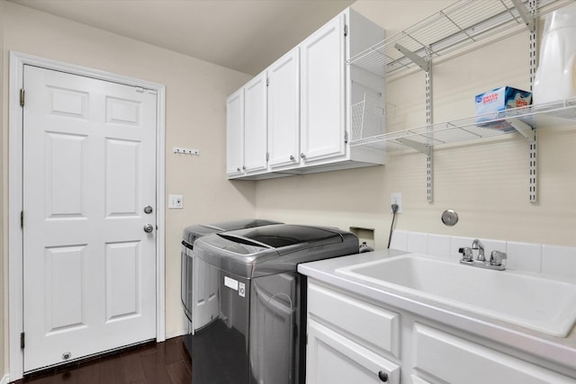 2019 S Saint Charles Rd, Veradale, WA 99037 - washroom featuring cabinet space, dark wood finished floors, and washer and clothes dryer
